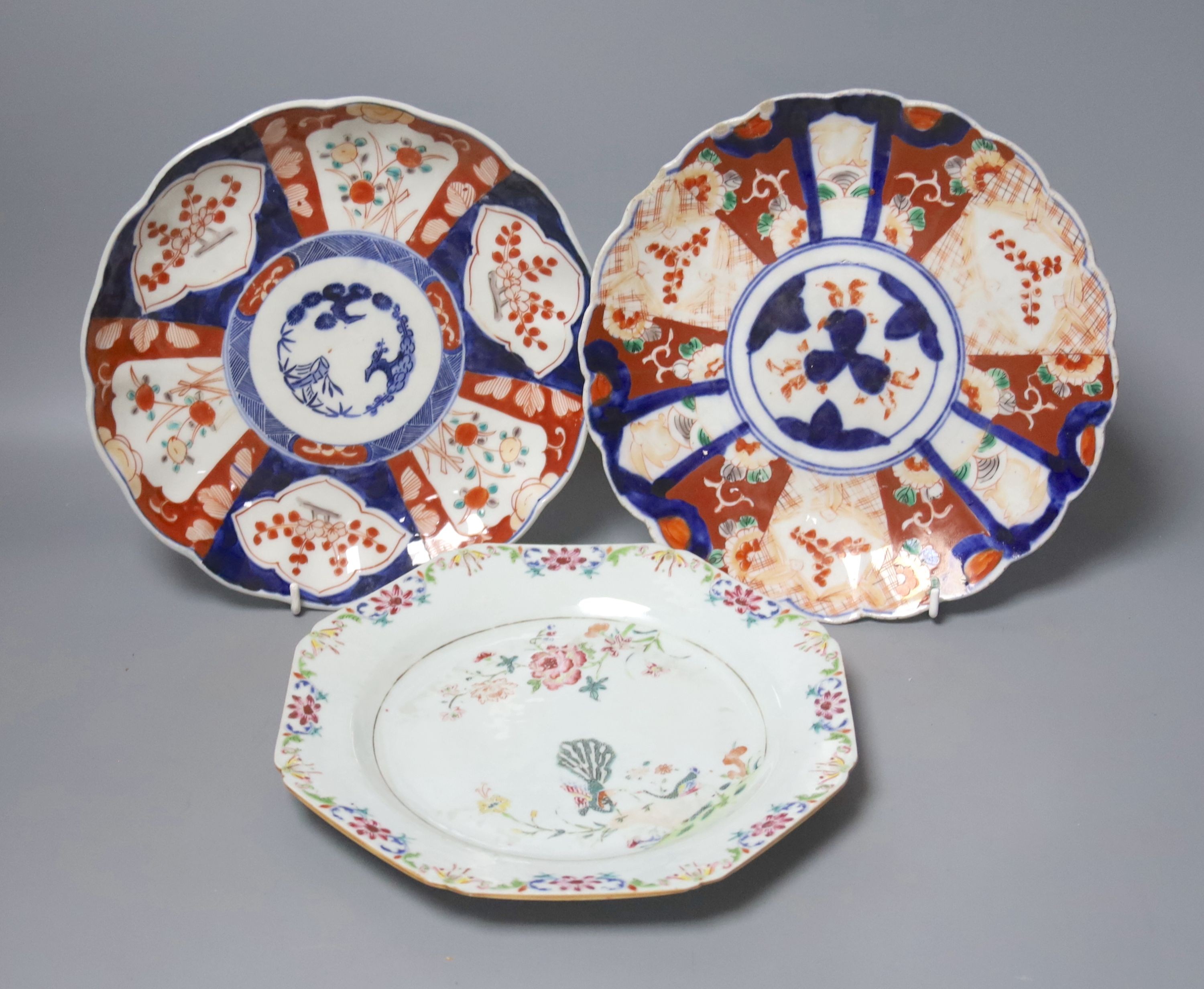 A Chinese Qianlong ‘double peacock’ octagonal plate, 21.5cm and two Imari dishes
